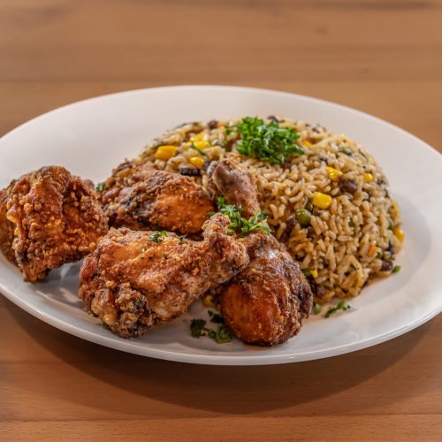 a plate of fried chicken and rice